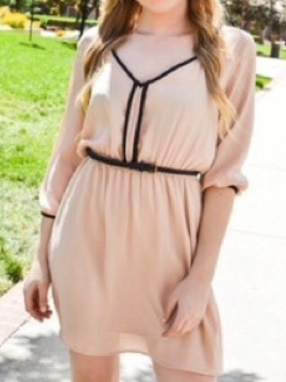 Nude/ pale blush trimmed with black  above the knee dress